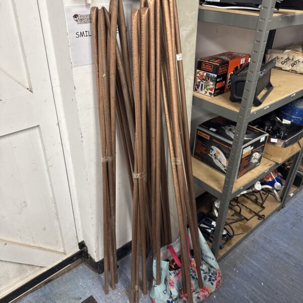Lot of bent copper pipe and plumbing fittings for DIY projects.
