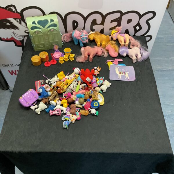 Colourful My Little Pony toy lot with various pony figures.