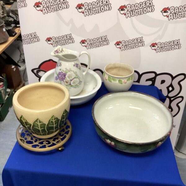 Vintage china wash bowls and plant pots with floral patterns.