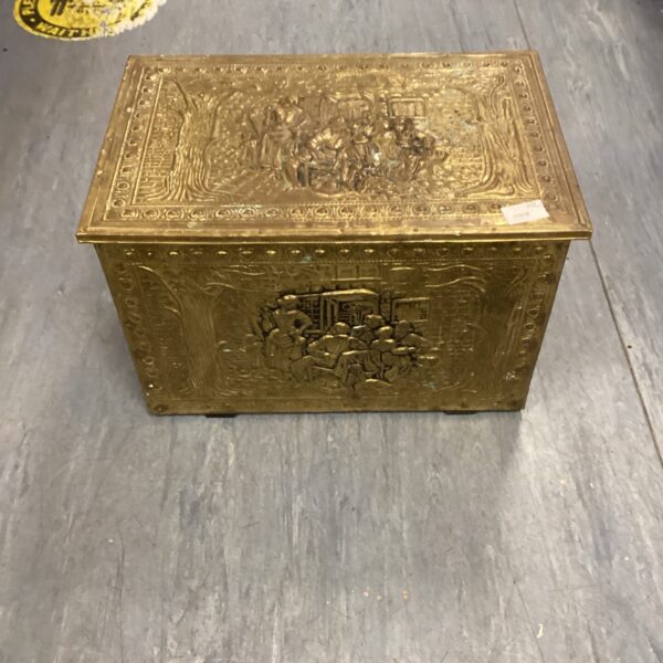 Intricate vintage copper fireside box with embossed cherub design.