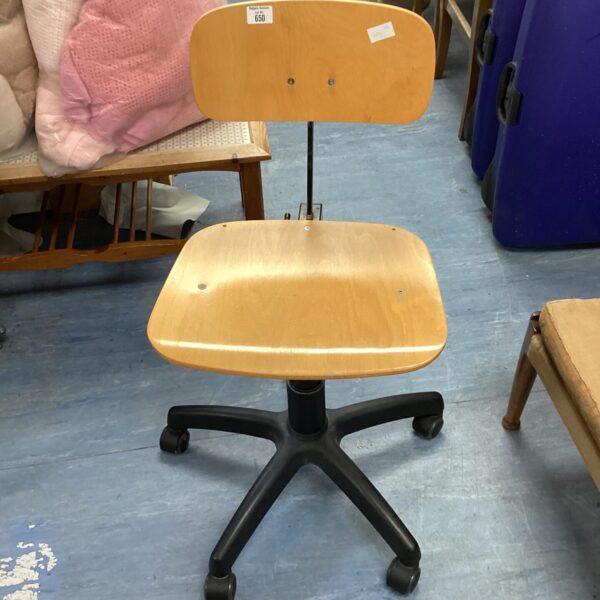 Vintage wooden swivel office chair with five-star base.
