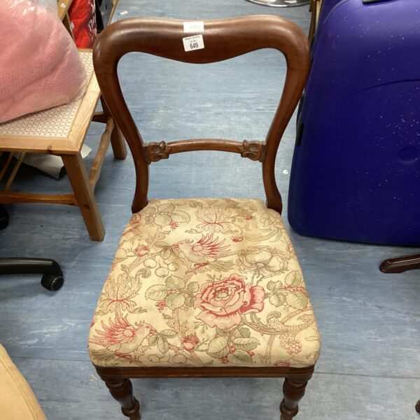 Elegant Victorian mahogany balloon back chair with floral upholstery.