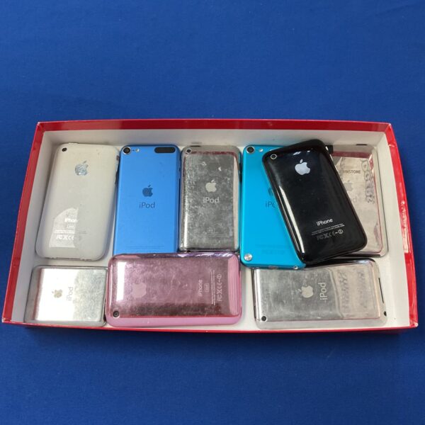 Tray of vintage Apple iPods, including Classic and Nano models.