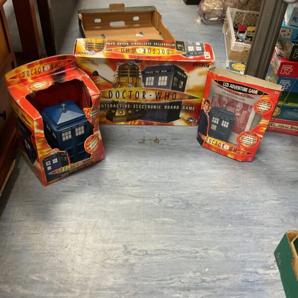 Doctor Who toy lot including electronic board game and money bank.