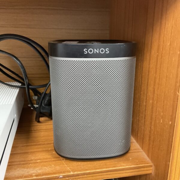 Compact Sonos Play 1 wireless smart speaker in a home setting.