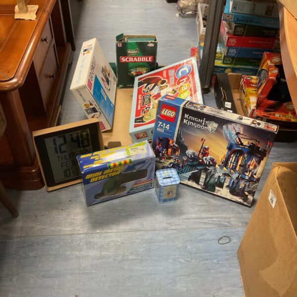Overview of a mixed toy lot including Scrabble and Lego.