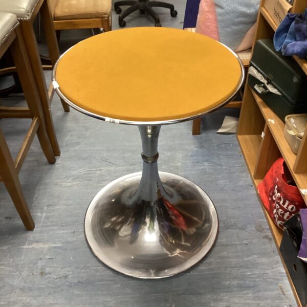 Vintage chrome bar table with circular top and polished base.