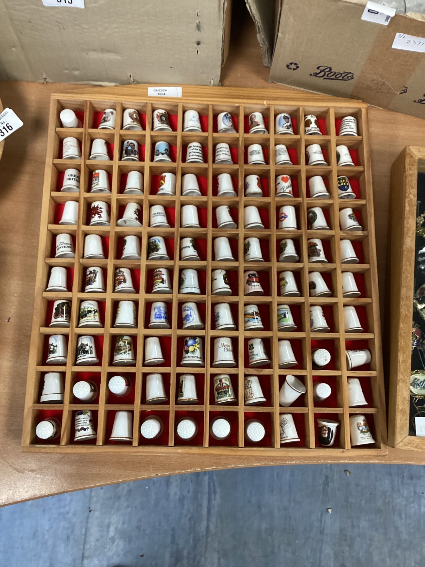 318 Collection of Thimbles in wall hanging frame