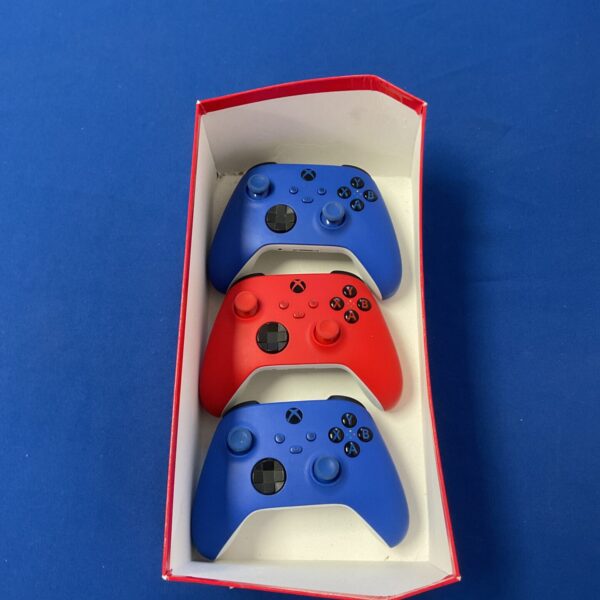 Lot of three Microsoft Xbox One controllers presented as-found.
