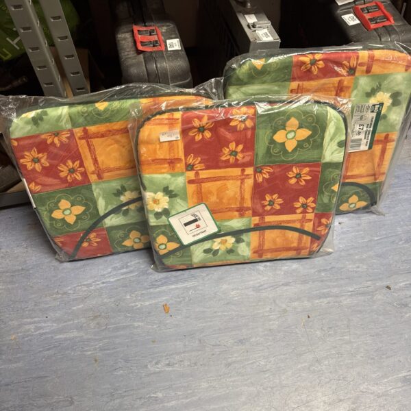 Set of three floral chair cushions for home decor.