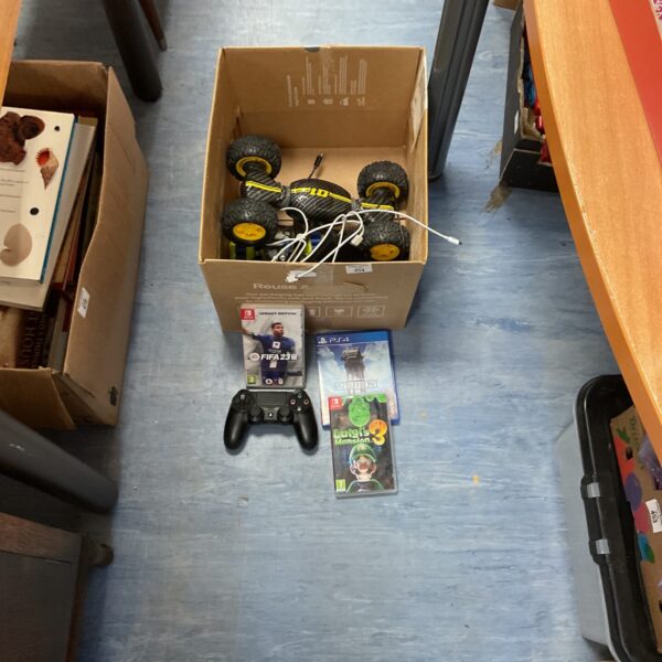 Mixed lot of RC car and gaming items including Nintendo and PS4.
