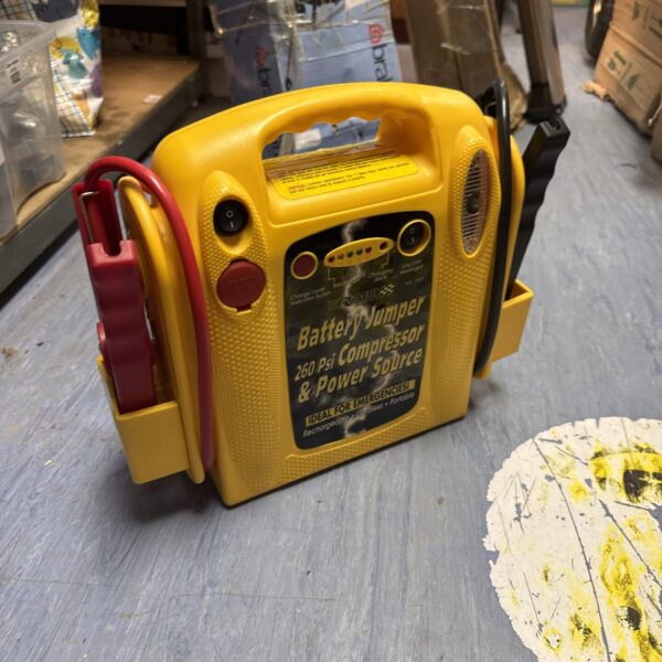Vintage Rally car jump starter booster pack, side view.