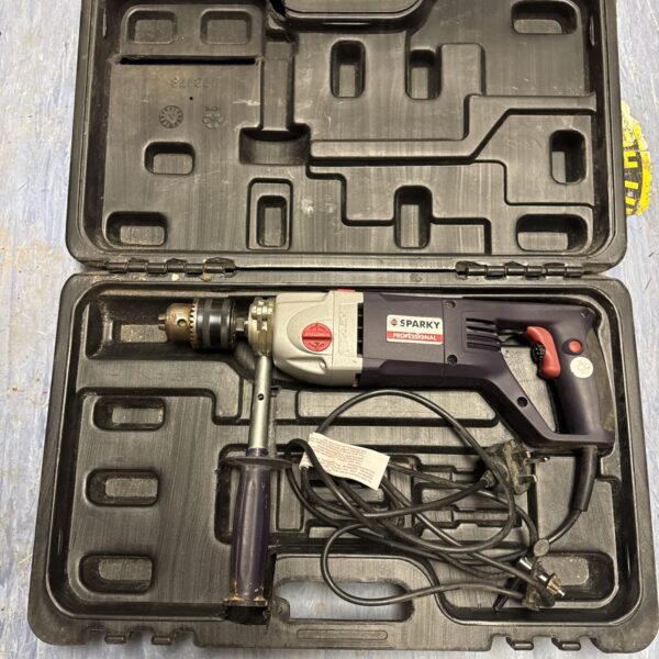 Sparky professional drill in its original carrying case.