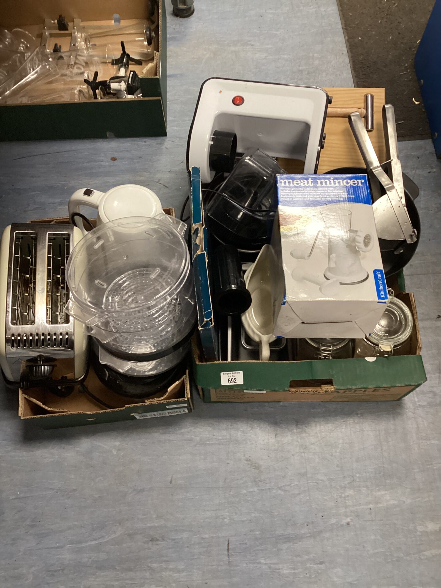 692 Two trays of kitchenware inc meat mincer, toaster & juicer