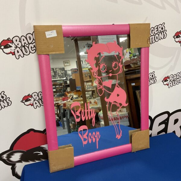 Vintage pink framed Betty Boop mirror, retro Hollywood glamour.