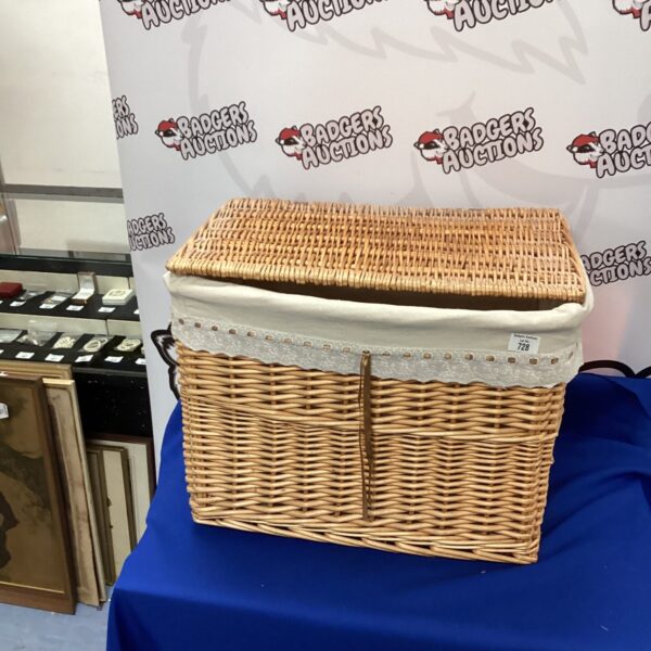 Large vintage wicker laundry basket for storage and farmhouse decor.