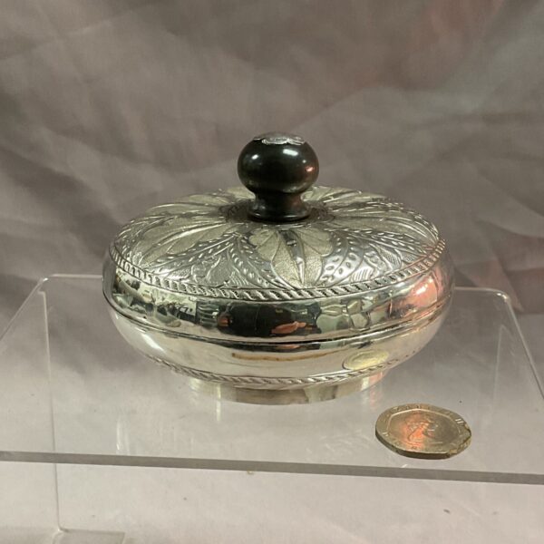 Silver pot with lid, embossed floral design, antique collectible.