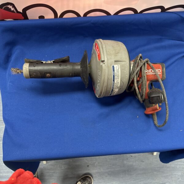 Used Rigid K-45 drain cleaner for clearing blocked pipes.