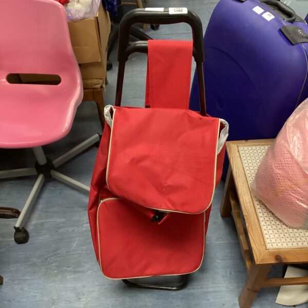 Red folding shopping trolley for groceries and easy transport.