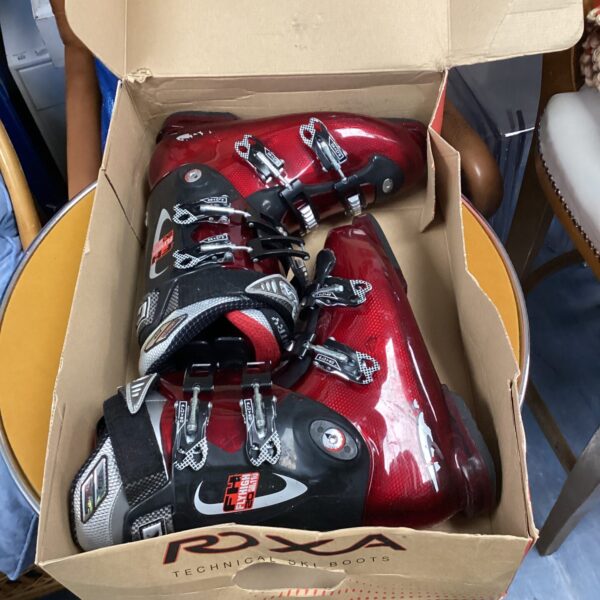 Pair of Roxa technical ski boots size 9 for alpine skiing.
