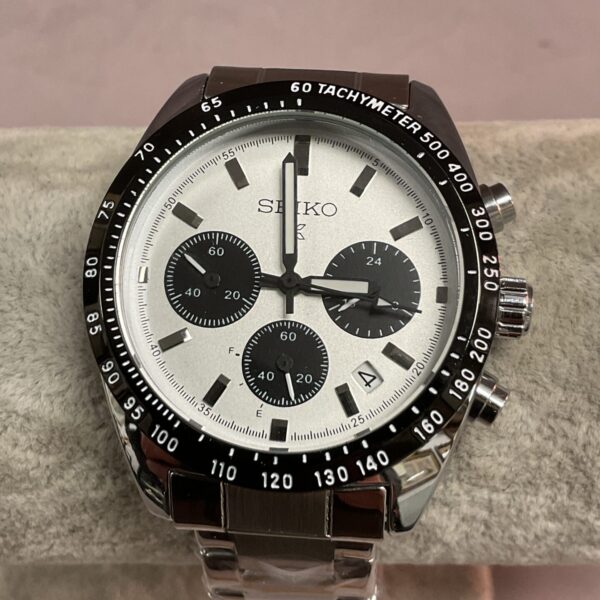 Front view of a stainless steel Seiko quartz wristwatch with tachymeter.