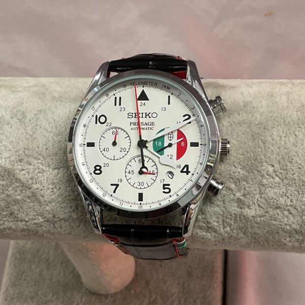 Silver Seiko quartz wristwatch with black dial.