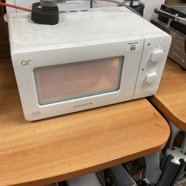 White Daewoo microwave oven for kitchen use.