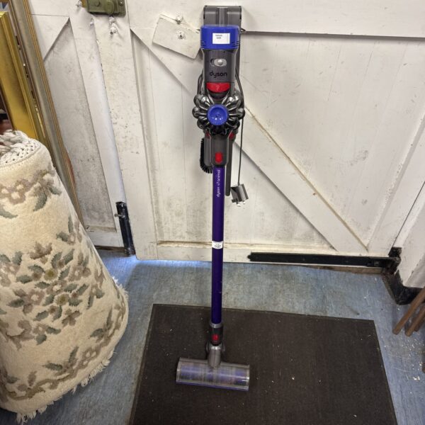 Dyson V7 Animal cordless vacuum cleaner in a home setting.