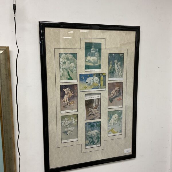 Framed vintage Bonzo the dog postcards by George Studdy, collectible ephemera.