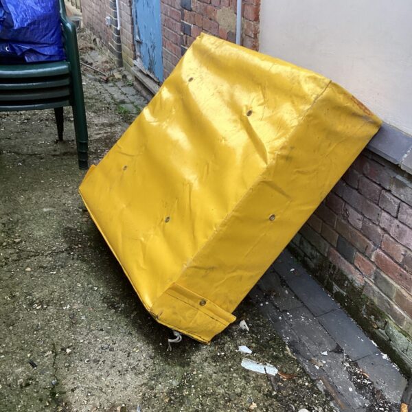 Vintage yellow drayman’s cushion, a piece of brewery history.