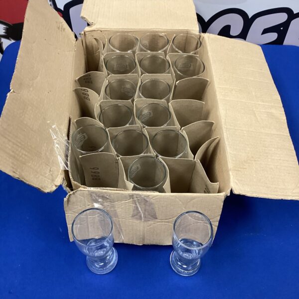 Set of sixteen Stella Artois half-pint glasses in a box.