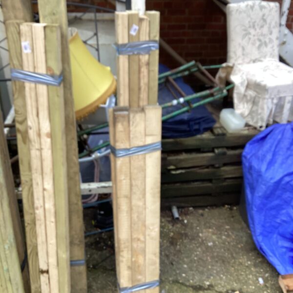 Stacked timber bundles ready for construction or DIY projects.