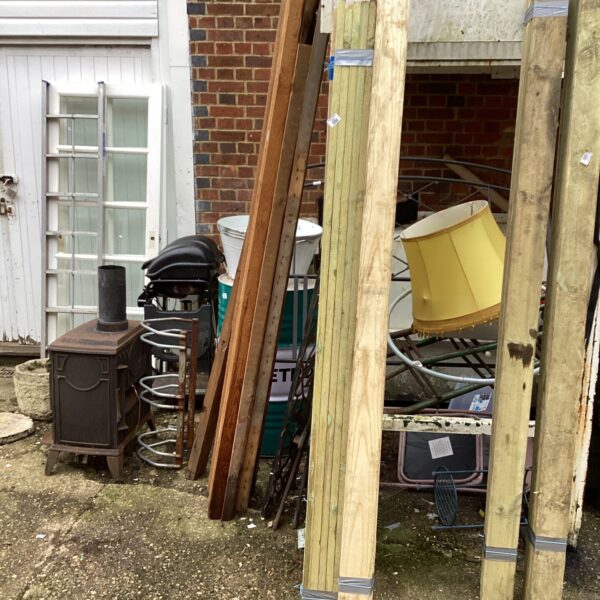 Bundle of nine-foot timber planks for construction projects.