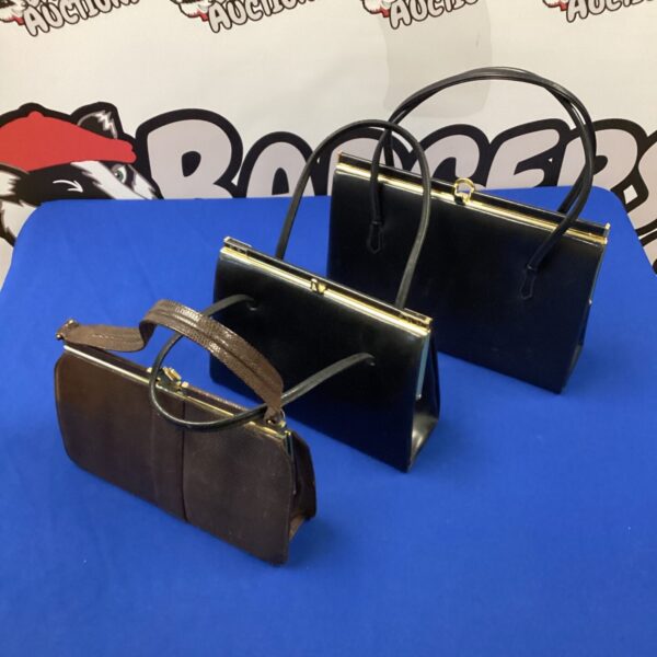 Lot of three vintage leather handbags, classic retro style.