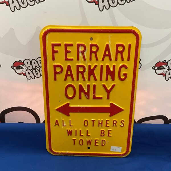 Vintage metal Ferrari parking sign for automotive collectors.