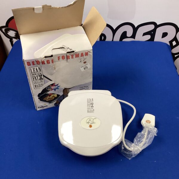 Retro George Foreman grill in used condition, a classic kitchen appliance.