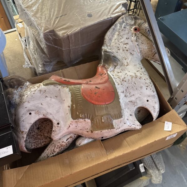 Antique rocking horse needing restoration, vintage children’s toy.