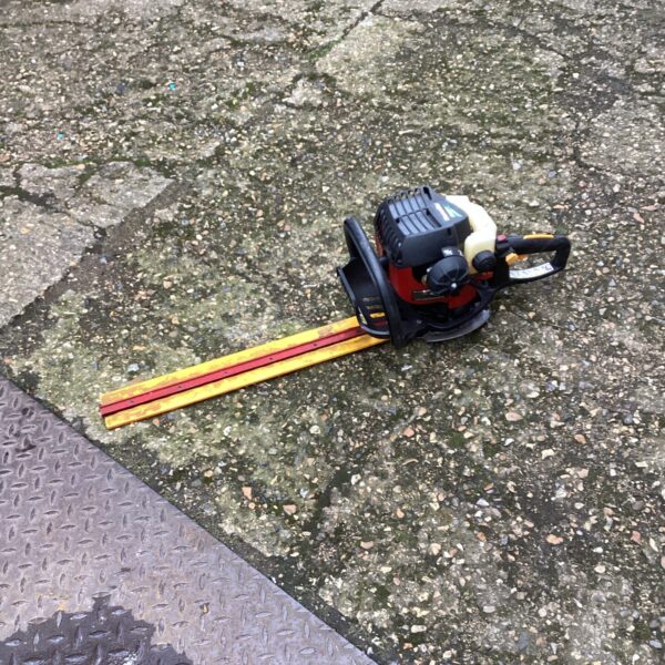 Used petrol hedge cutter for garden landscaping and maintenance.