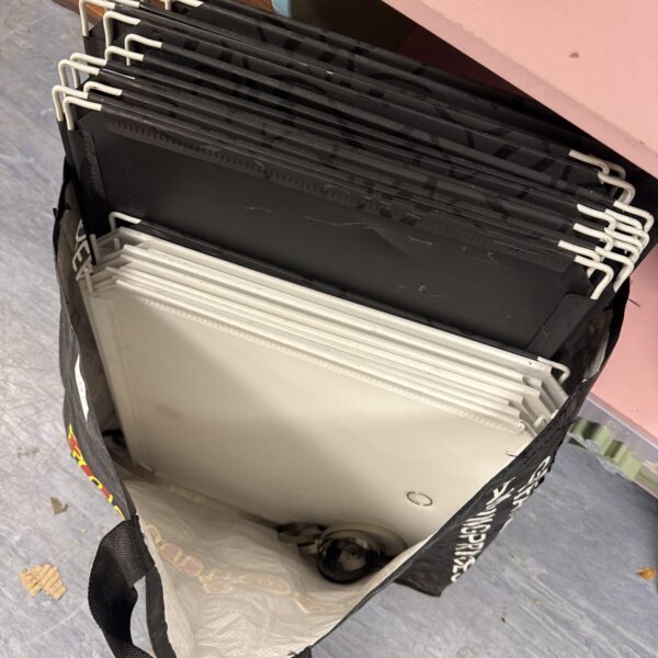 Collapsible wire cube storage unit with fabric panels.