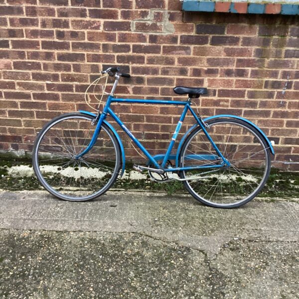 Side view of a vintage Raleigh bicycle with mudguards.