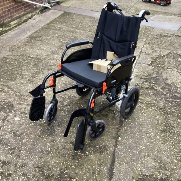 Used Soma electric folding wheelchair for mobility assistance.