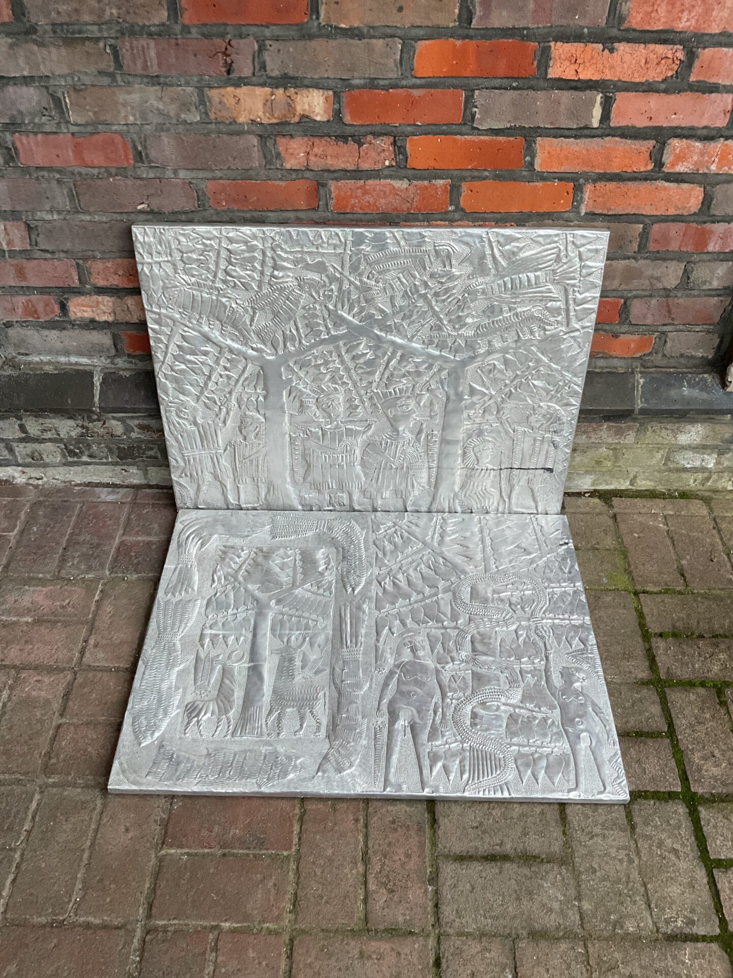 794 Pair of hammered & engraved south American aluminium panels