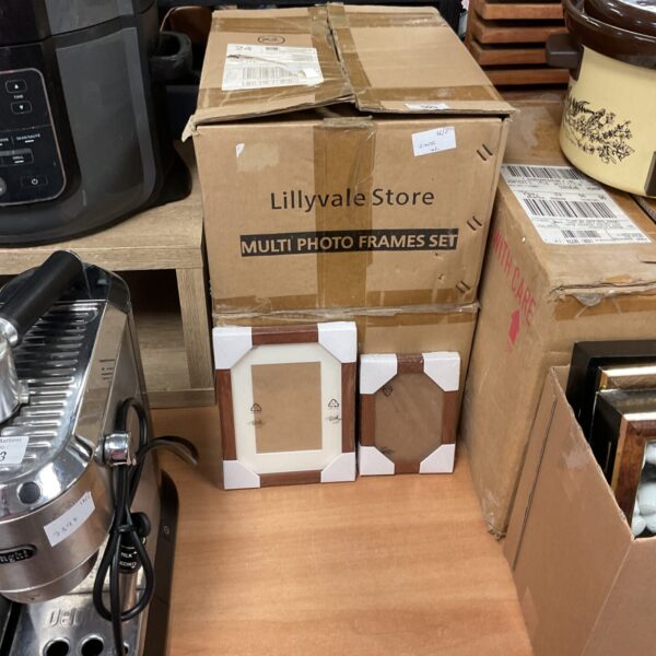 Two unopened boxes of new Lillyvale wood style photo frames.