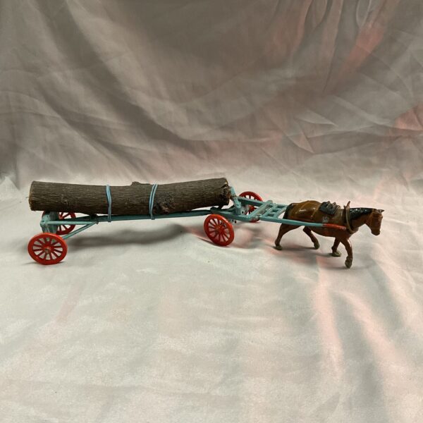 Vintage Britains diecast horse pulling a log trailer.