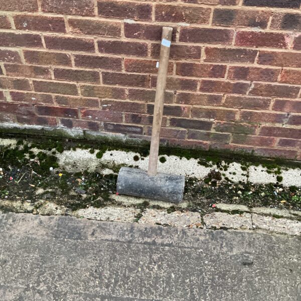 Rubber mallet with wooden handle for DIY and workshop use.