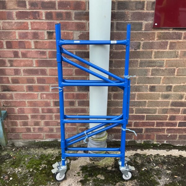 Blue mobile work tower on wheels for DIY projects.