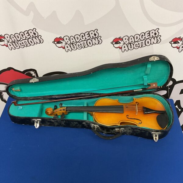 Child's Lark violin in open case with bow.