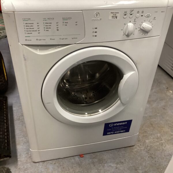 White Indesit WIB111 washing machine, front view.
