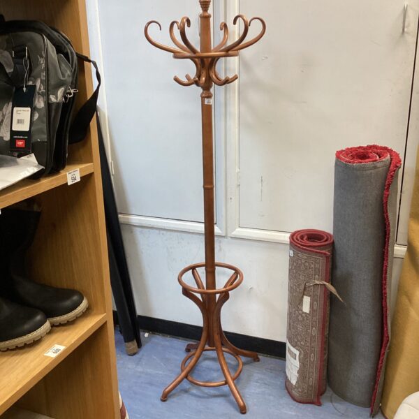 Vintage wooden coat and hat stand for hall storage.