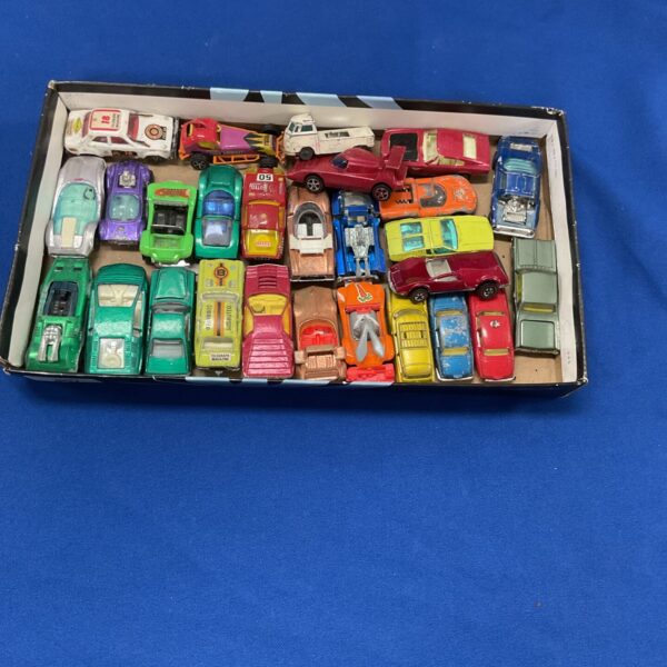 Mixed lot of vintage diecast toy cars including Husky, Corgi, and Hot Wheels.